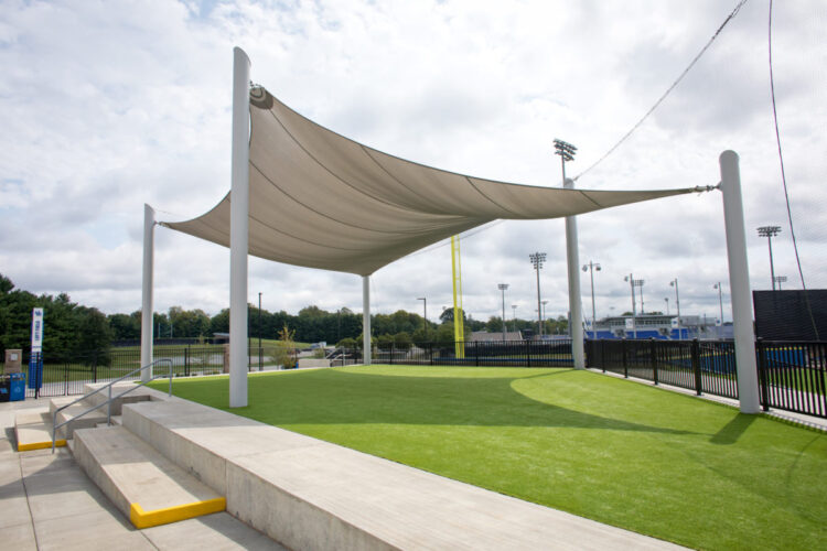 large beige sun shade on turf