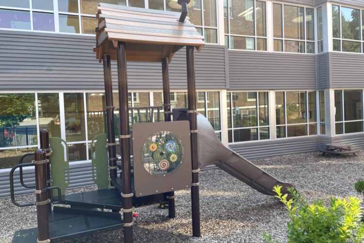 playground equipment next to Sayre Elementary building