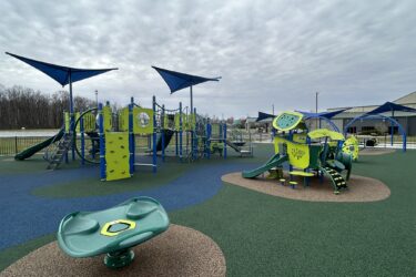 blue and green playground equipment at Crossroads Community Church