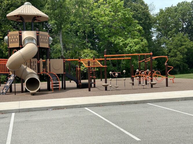 tube slide and side view of playground equipment