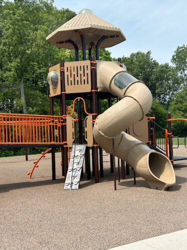 twisty tube slide with shaded roof