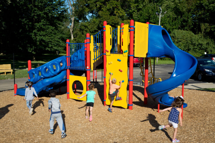 red yellow and blue climb tower with two slides and tunnel