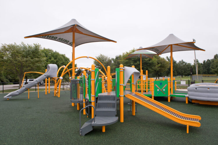 shaded bumpy slide with stairs and climbing arches