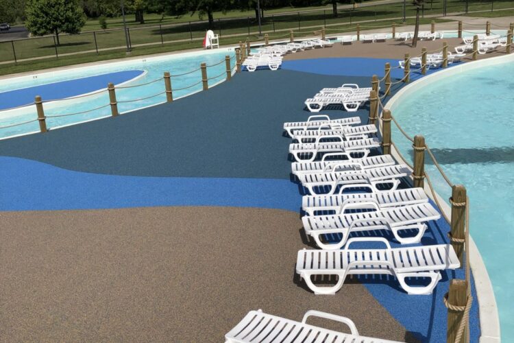 lawn chairs lined up in along surface between water areas