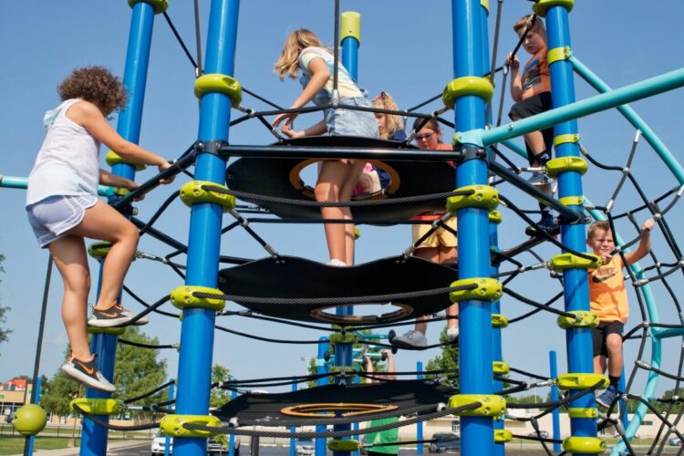 kids climbing to the top of the climbing tower