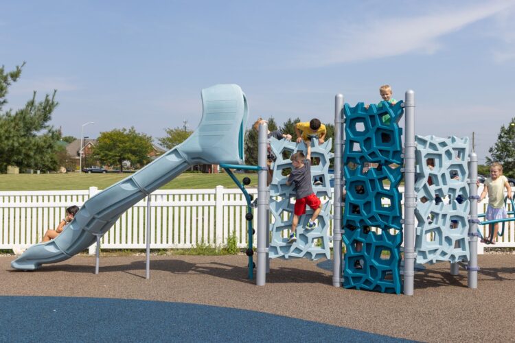 climbing wall that leads to large slide