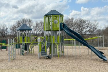 selection of ladders, rock wall and curved rails to climb up to covered platform for slides
