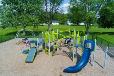play structure with a roller slide and curvy slide