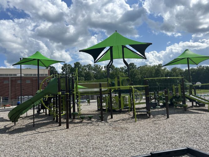 large play structure with 3 shades and play events
