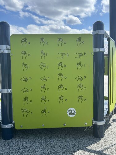 green panel with sign language alphabet