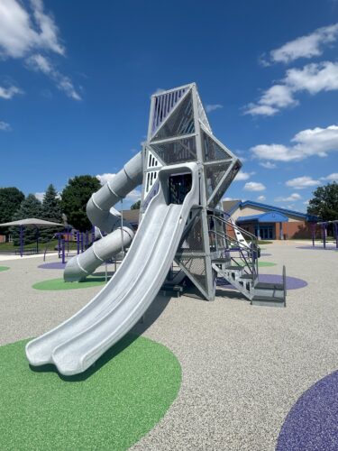 multi-level play structure with double slide and curly tunnel slide