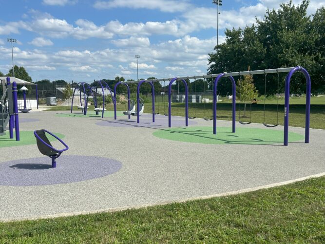 6 bays of swings including 6 belt seats, 2 adaptive swings, and 2 multi-person swings