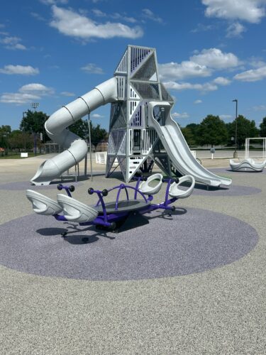 4 person seesaw and a play structure tower with 3 slides