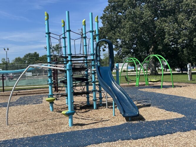 cable climbing play structure with blue slide
