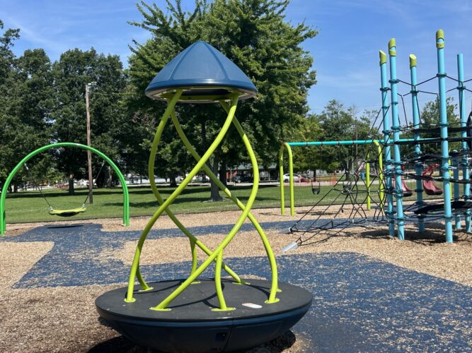 green and blue multi-person spinner