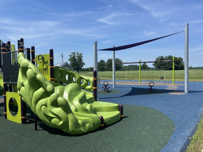 lime green climber on play structure