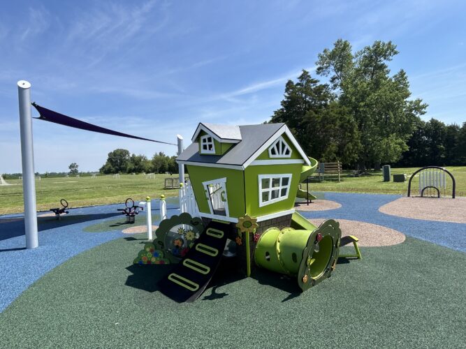 imaginative play house with purple fabric shade and musical chimes