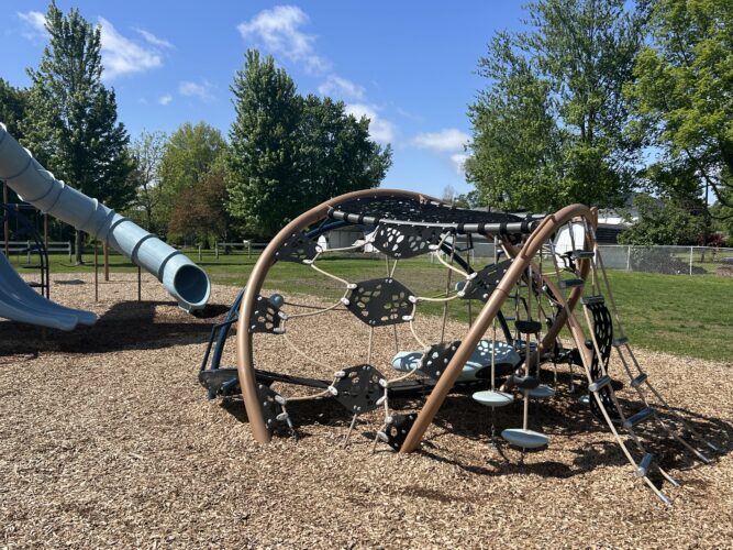 angular and sculptural play structure with multiple climbing routes