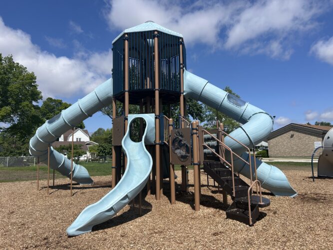 light blue and brown, 2 story play structure with 3 slides