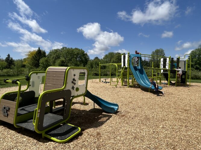 1 blue and green play structure for 2-5 year old kids and 1 blue and green play structure for 5-12 year old kids
