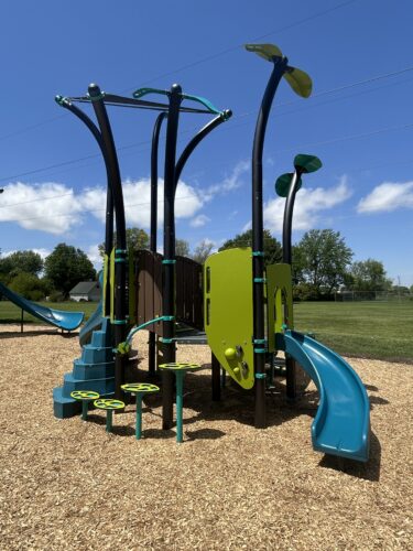 blue and green playground for 2-5 year old kids with integrated shade, 2 slides, and steppers