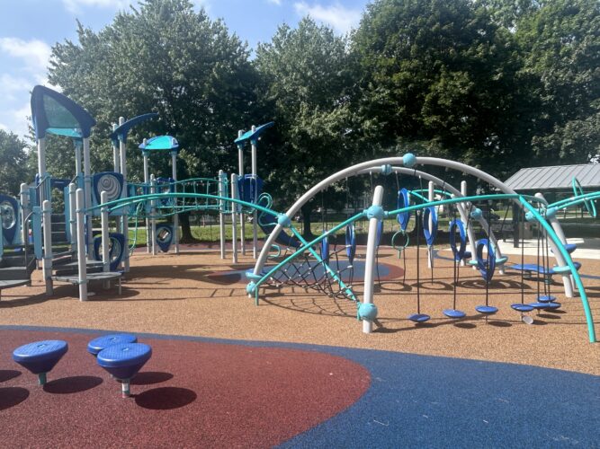 play structure for kids ages 5-12 with climbers and steppers on rubber safety surfacing
