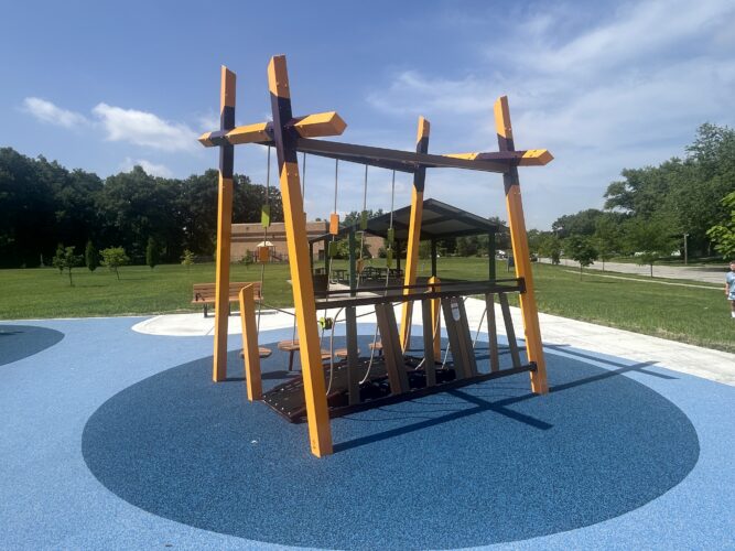 climbing structure with materials that provide sensory stimulation