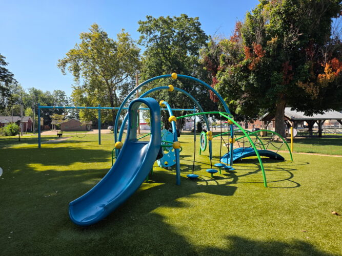 blue slide for kids ages 2-5 on turf surfacing