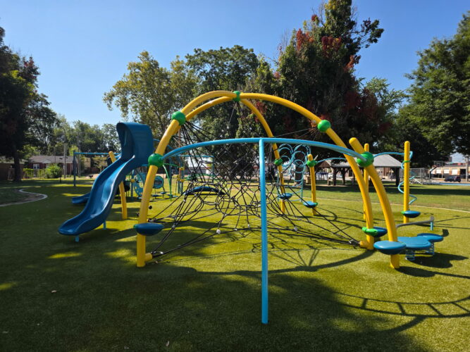yellow, blue, and green play structure for kids ages 5-12