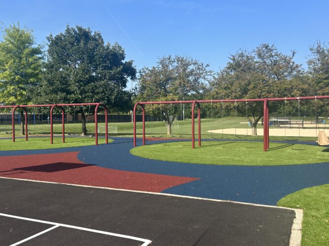 6 bays of swings with 11 belt swings and 1 molded bucket seat swing