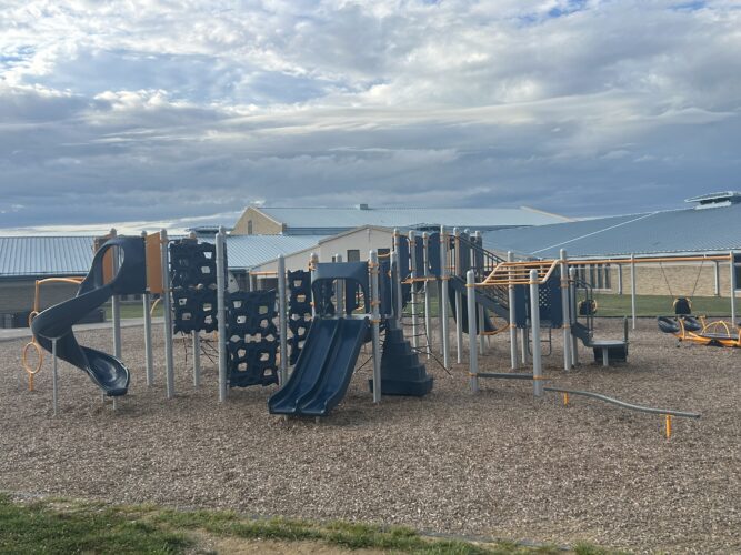 orange, blue, and gray play structure for kids ages 5-12