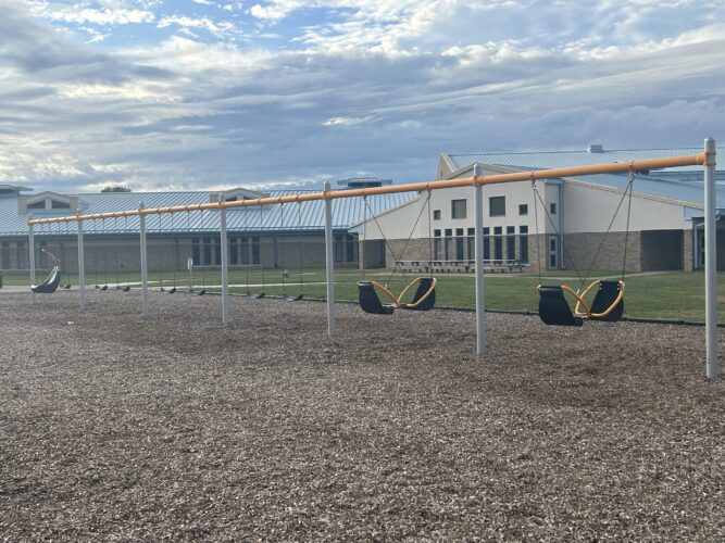 6 bays of swings with 1 molded bucket seat, 7 belt swings and two 2-person swings
