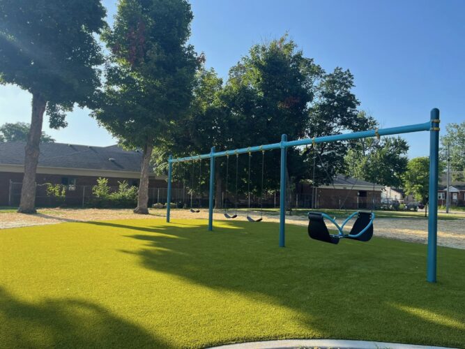 3 bays of swings with 1 baby swing, 3 belt swings, and a 2 person facing each other swing