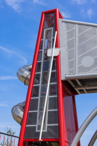 40-foot red tower designed to look like a giant metronome, marking the rhythm of the space.