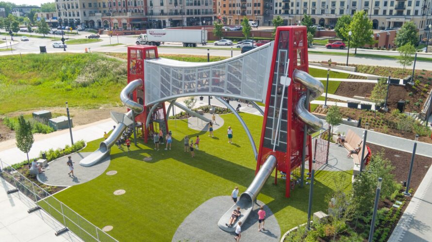 40ft and 30ft tower with a curly slide coming off the towers and a connecting bridge