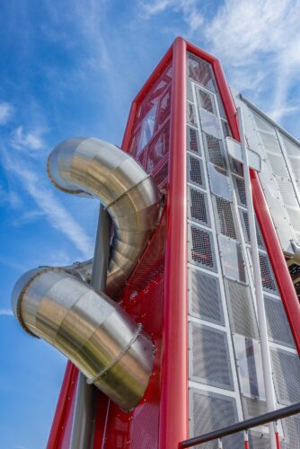 massive 40ft tower with a curly slide that runs inside and outside the tower
